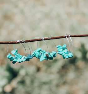 Turquoise rock hoops.